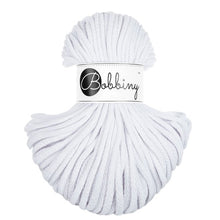 A skein of white bobbiny braided cord with a white paper label that reads 'Bobbiny' in black script and logo, set against a plain white background.