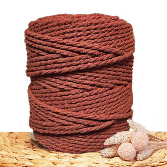 A roll of 5mm Terracotta Macrame Cord againsta white background