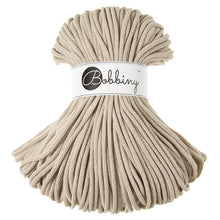 A bundle of textured beige cord wrapped with a white paper band featuring the brand name 'Bobbiny' in black script.