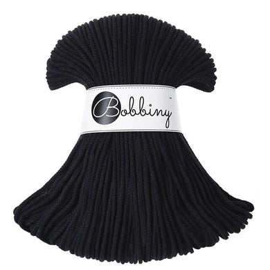 A black braided cord bundle wrapped with a white paper band printed with the brand name 'Bobbiny' in black script, shown on a plain white background.