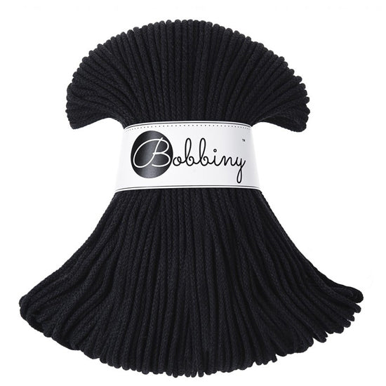 A black braided cord bundle wrapped with a white paper band printed with the brand name 'Bobbiny' in black script, shown on a plain white background.