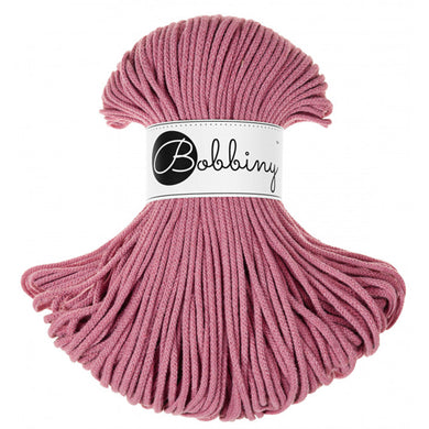 A bundle of pink braided cord with a white paper label wrapped around the center that reads 'Bobbing' in black script and logo, set against a plain white background.