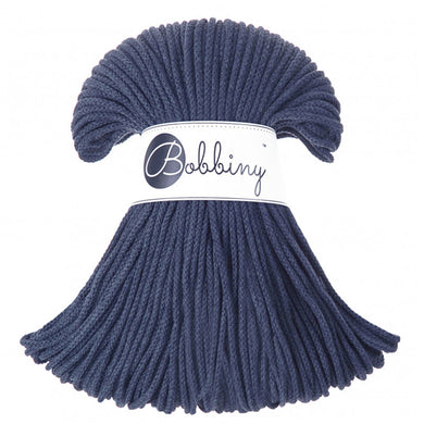 A bundle of denim blue braided cord with a white paper band around the middle that reads 'Bobbing' in script and logo, shown on a plain white background.