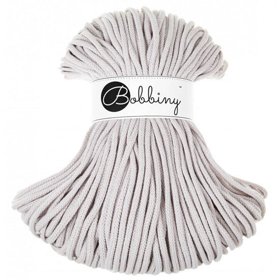 A skein of light grey, silver braided cord with 'Bobbiny' label on a white background