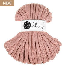 A blush pink chunky braided cord bundle with a white paper label reading 'Bobbiny' in black script, set against a plain white background with a small 'NEW' badge in the top-left corner.