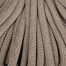 A close-up of braided cord in a warm taupe coffee brown color, showing the detailed knit pattern and folds.