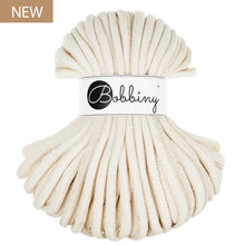 A skein of thick, natural colored braided cord with a white paper label in the center that reads 'Bobbiny'. A small brown 'NEW' label is in the top-left corner.