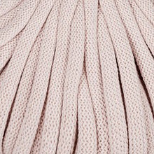 A close-up of a light pink nude braided cord.