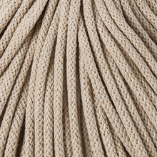 A close-up of cord in a beige color, filling the entire frame.