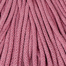 A close-up of blossom braided cord texture filling the frame.