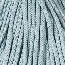 A close-up of a light blue rbraided cord, showing the detailed vertical ribbing and woven pattern.