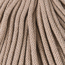A close-up of thick braided cord in a sand color, filling the entire frame.