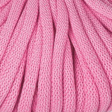 A close-up of bright pink braided cord with a textured weave pattern.