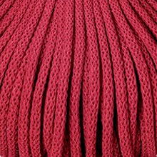 A close-up of a textured red braided cord filling the entire frame.