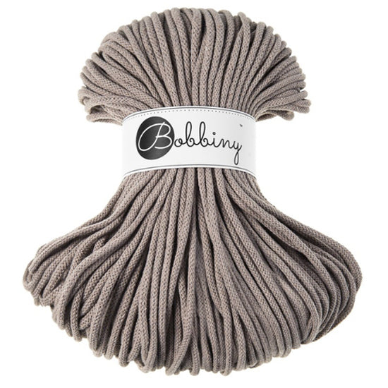 A bundle of thick coffee cord wrapped with a white paper band labeled 'Bobbiny' in black script, set against a plain white background.