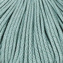 A close-up of duck egg blue braided cord filling the frame.