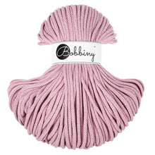 A bundle of dusty pink braided cord with a white paper label wrapped around the middle that reads 'Bobbiny'.