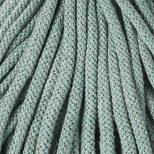 A close-up of braided cord in a muted sage green color, showing the detailed texture of the yarn and stitching.