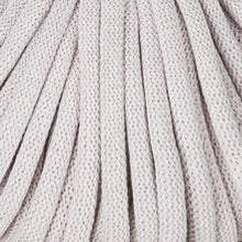 A close-up of a braided cord texture in a light grey color, showing the detailed knit or woven pattern.
