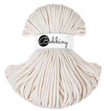 Ball of natural colored cord with a Bobbiny label on a white background