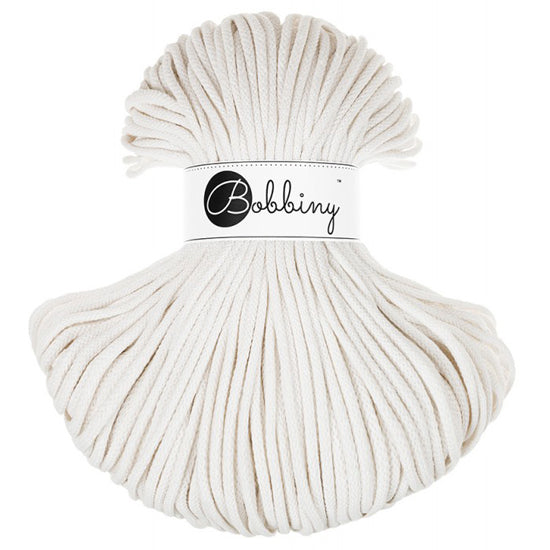 A bundle of off-white braided cord with a white paper band around the middle that reads 'Bobbiny' in black script, photographed on a plain white background.