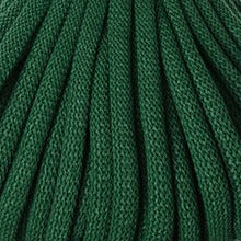 A close-up of dark green braided cord filling the frame, showing the woven texture and vertical folds.