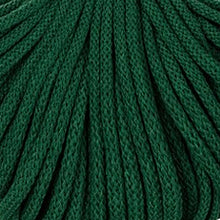 A close-up of dark green braided cord filling the frame, showing the textured weave and layered strands.
