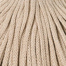 A close-up of a beige braided 5mm cord