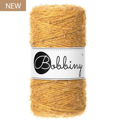 New Bobbiny 3mm Mustard Boucle Cord 100m in a rich golden yellow shade, with Bobbiny label and NEW product badge.